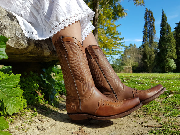 Women's leather ankle boots in brown and earth tones